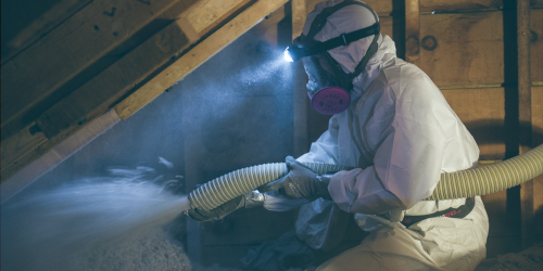 person installing insulation
